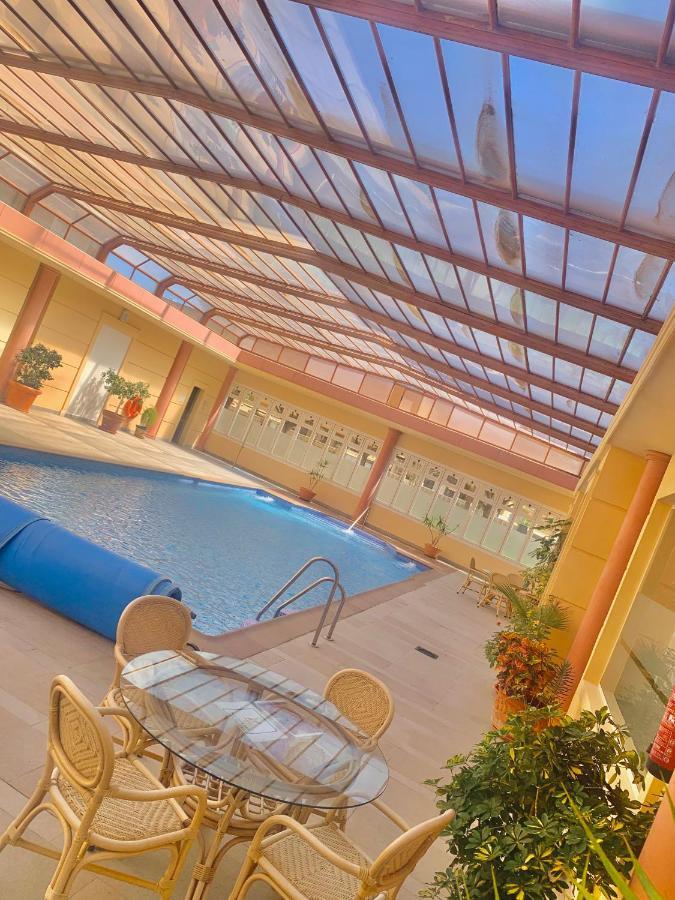 ÁTICO DELUXE entre CENTRO y PLAYA Salinas con TERRAZA, WIFI, PISCINA climatizada, GYM, SAUNA y GARAJE -Smart TV Roquetas de Mar Esterno foto